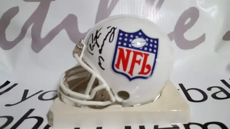 Peyton Manning and Eli Manning autographed NFL mini helmet
